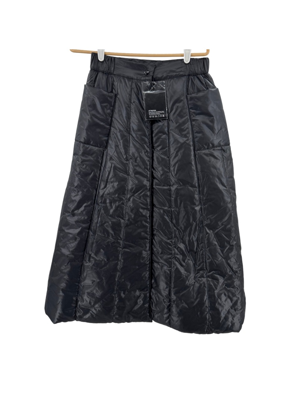 Black puffer snap front maxi skirt winter neutral pockets outdoor casual ski